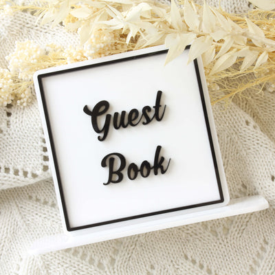 white guest book sign